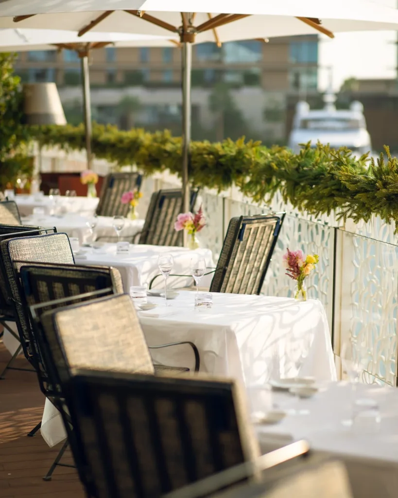 Hervé Baume wrought-iron outdoor furniture, Bvlgari Resort Dubai – HB12 chairs and HB30 tables.