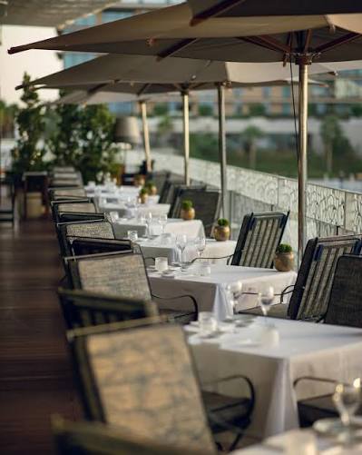 Hervé Baume wrought-iron outdoor furniture, Bvlgari Resort Dubai – HB12 chairs and HB30 tables.