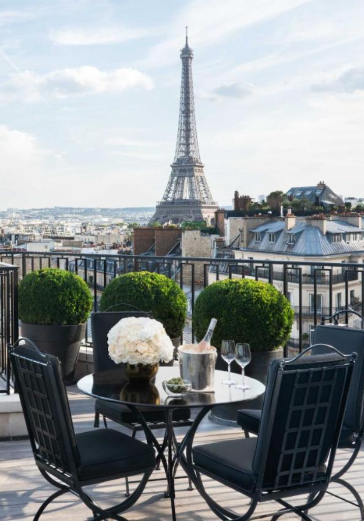 Hervé Baume HB3 Lattes Collection wrought-iron furniture on the terrace of Four Seasons Hotel George V, Paris, overlooking the Eiffel Tower.