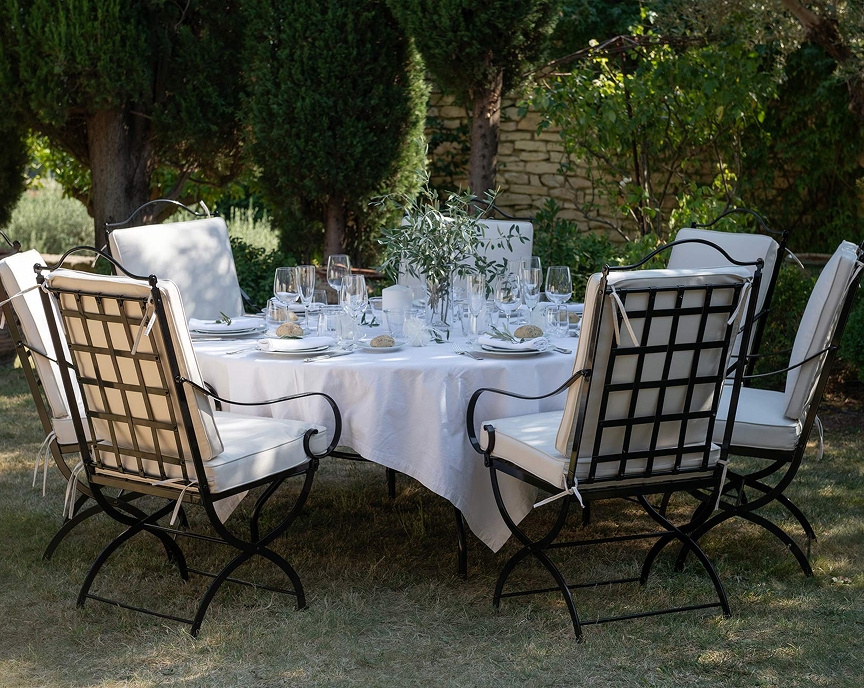 Set garden table surrounded by Hervé Baume wrought-iron armchairs, HB1 Quadrillage Collection.