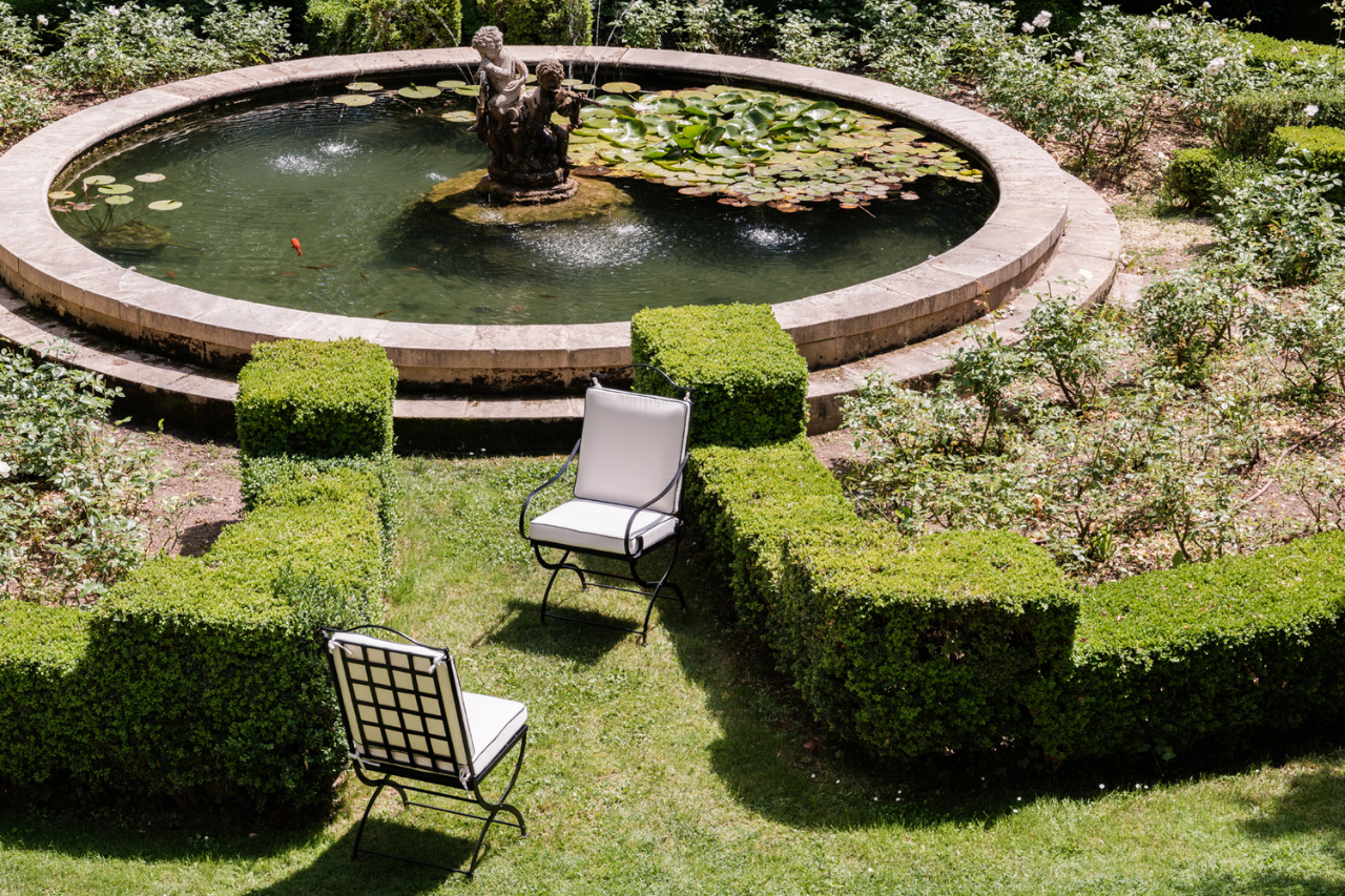 Hervé Baume wrought-iron garden chairs by the fountain, Mas de Chabran.